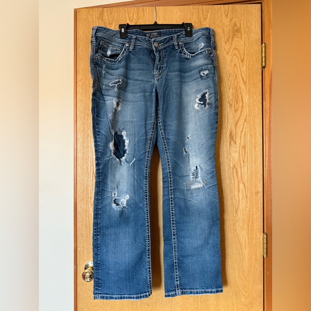 Aiko Silver jeans. Distressed wear. Mid rise. Baby boot.